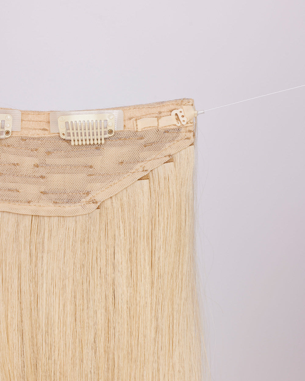 Close-up of BHBD hairband clip: hook & fishing line for adjustability.