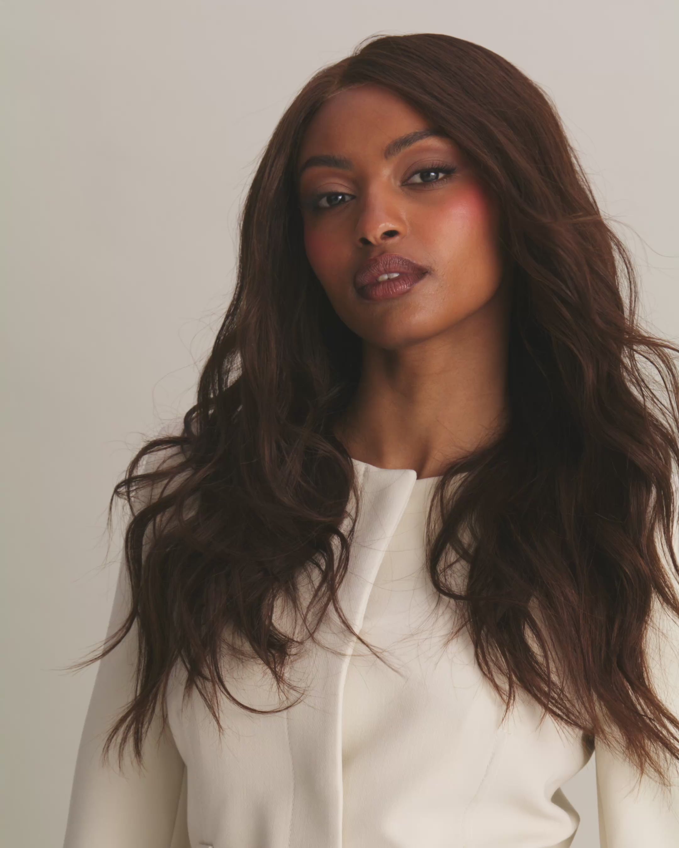 Woman wearing a BHBD Valentina wig. Long natural dark brown wig. 